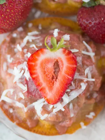 Mini Gluten Free Strawberry Rhubarb Upside Down Cake Recipe: ursting with sweet strawberries, sour rhubarb, and a spritz of summery lemon, these gluten-free & refined sugar-free w/ vegan option Strawberry Rhubarb Upside Down Cakes taste like a breezy summer day in the Southern sun!