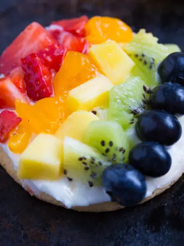 Personal Rainbow Fruit Pizzas with Key Lime Cream Cheese Frosting