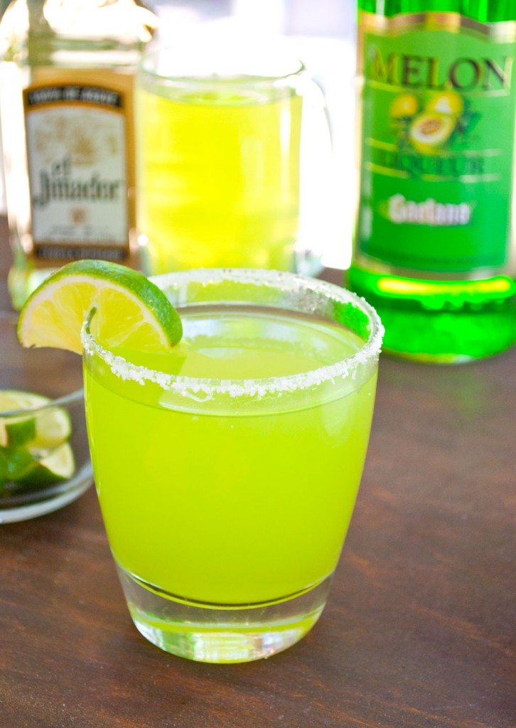 melon ball margarita with salted rim and lime wedge