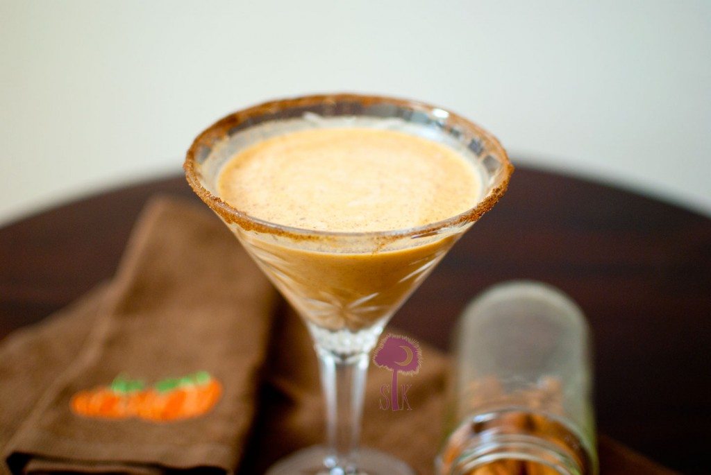 Pumpkin spice latte martini in a martini glass rimmed with cinnamon sugar