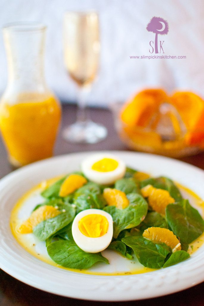Fresh spinach salad with hardboiled eggs and oranges
