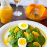Fresh spinach salad w/ hard boiled eggs and oranges