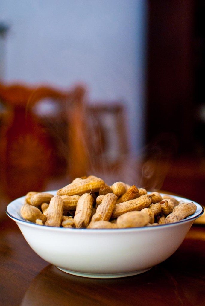 Steaming bowl of cooked peanuts