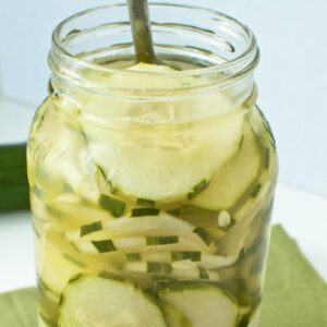 cumumbers and vinegar in a mason jar