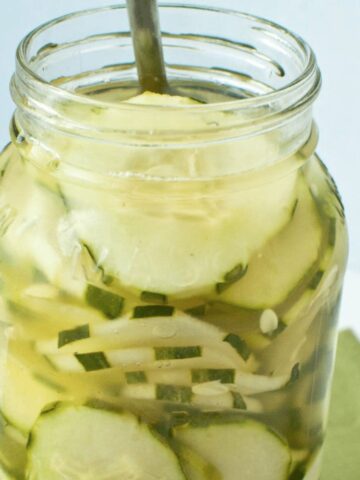 cumumbers and vinegar in a mason jar