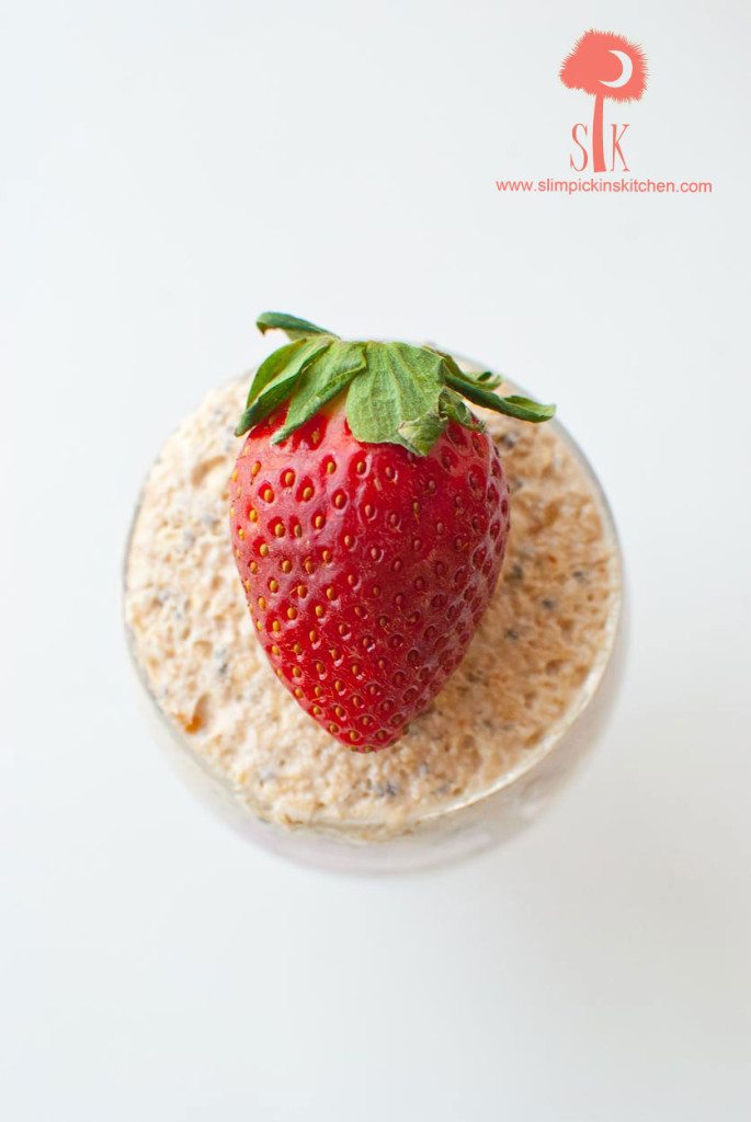 Close up of strawberry on peanut butter and jelly overnight oats