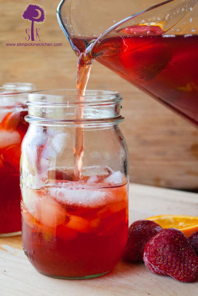 Strawberry Sweet Tea Pouring Into a Mason Jar 