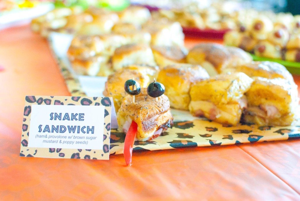 Close up of safari party snake sandwich with olives as eyes and peppers as a tongue