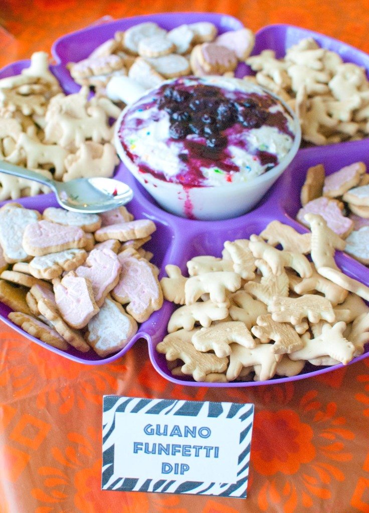 funfetti dip topped with blueberry pie filling served with animal crackers