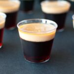 A close up picture of a Baby Guinness Jello Shots