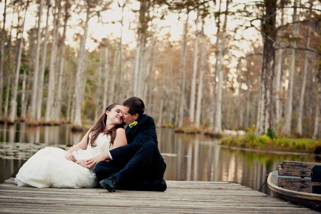 newly married couple on dock at Cypress Gardens