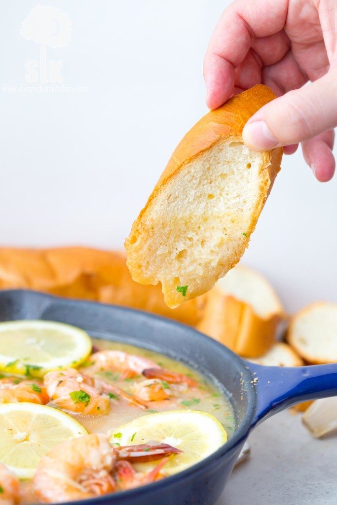 Lemon Shandy Peel and Eat Shrimp Recipe: A quick and easy peel and eat shrimp recipe that's made with lemon shandy beer, fresh garlic and herbs, butter and steamed shrimp! 