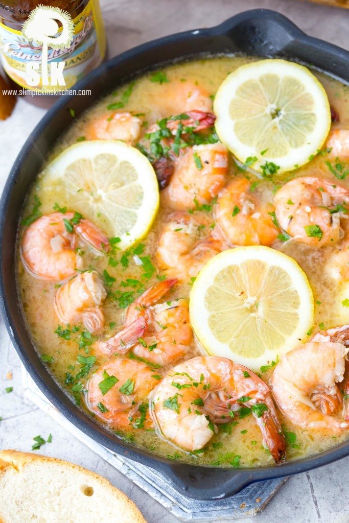 Lemon Shandy Peel and Eat Shrimp Recipe: A quick and easy peel and eat shrimp recipe that's made with lemon shandy beer, fresh garlic and herbs, butter and steamed shrimp! 