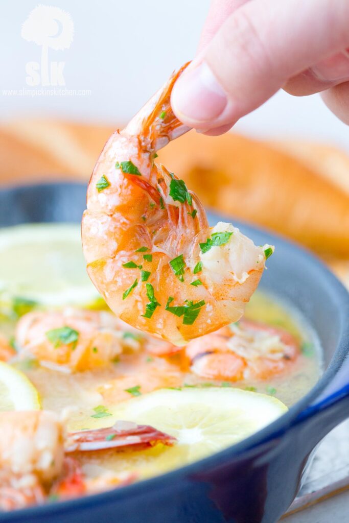 Lemon Shandy Peel and Eat Shrimp Recipe: A quick and easy peel and eat shrimp recipe that's made with lemon shandy beer, fresh garlic and herbs, butter and steamed shrimp!