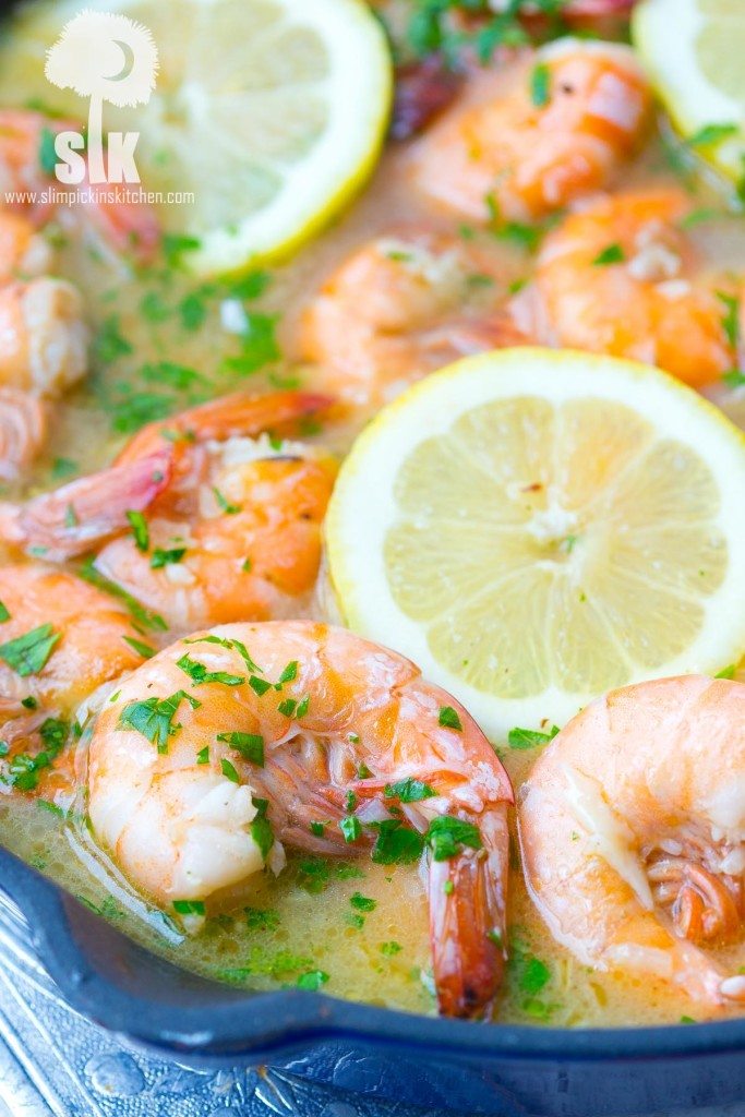 Lemon Shandy Peel and Eat Shrimp Recipe: A quick and easy peel and eat shrimp recipe that's made with lemon shandy beer, fresh garlic and herbs, butter and steamed shrimp! 