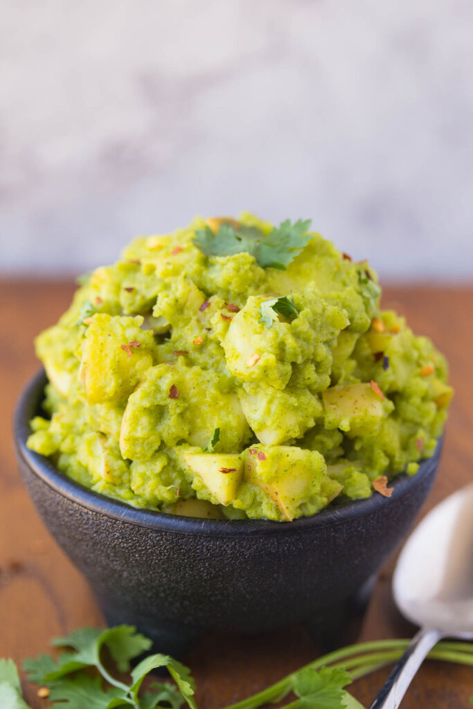 Honey Cilantro Chimichurri Potato Salad: A gluten-free, vegetarian and mayonnaise free potato salad recipe that's made with fresh herbs, a touch of honey, and a kick of cayenne while staying simple, light, and satisfying.