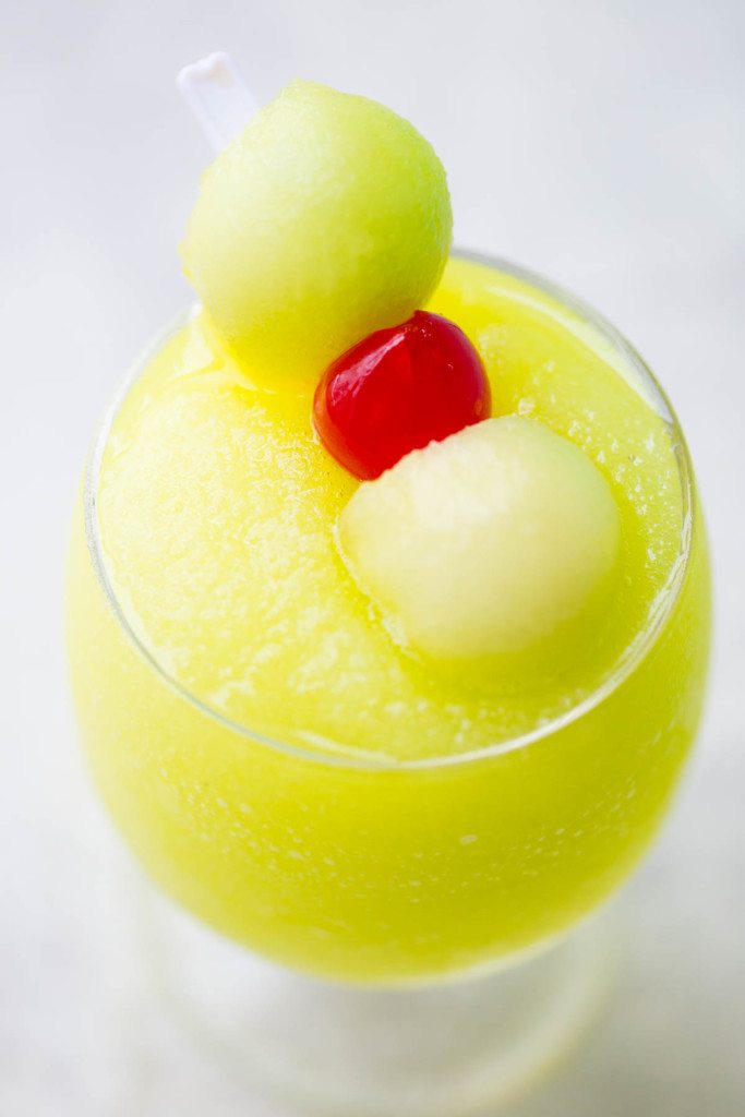 Spiked Melon Ball Slushies: A frozen twist on the classic melon ball drink made with freshly frozen Honeydew, melon liquor, melon vodka, and sweet pineapple juice.