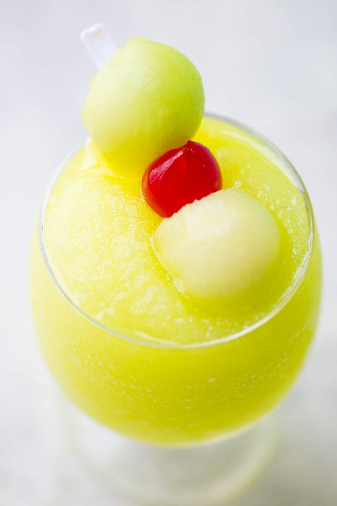 Spiked Melon Ball Slushies: A frozen twist on the classic melon ball drink made with freshly frozen Honeydew, melon liquor, melon vodka, and sweet pineapple juice. 