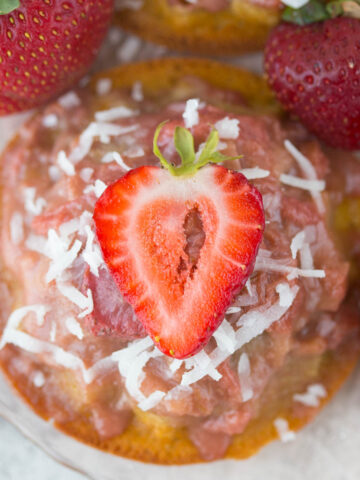 Mini Gluten Free Strawberry Rhubarb Upside Down Cake Recipe: ursting with sweet strawberries, sour rhubarb, and a spritz of summery lemon, these gluten-free & refined sugar-free w/ vegan option Strawberry Rhubarb Upside Down Cakes taste like a breezy summer day in the Southern sun!