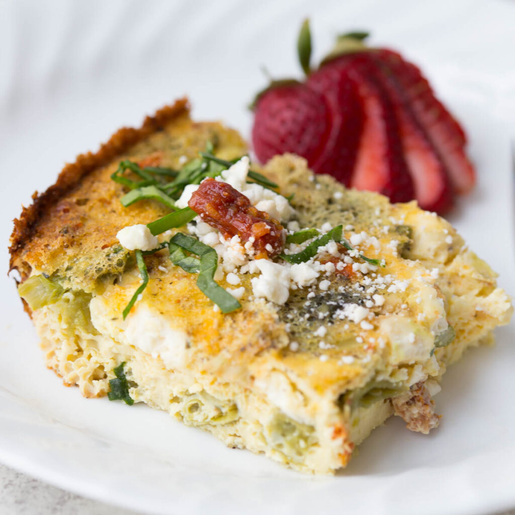 Slow Cooker Sundried Tomato, Asparagus, and Feta Fritatta: An delicious and healthy breakfast recipe that's made in the slow cooker! This recipe is great for a Mother's Day brunch, bridal shower, or for your meal planning for the week. 
