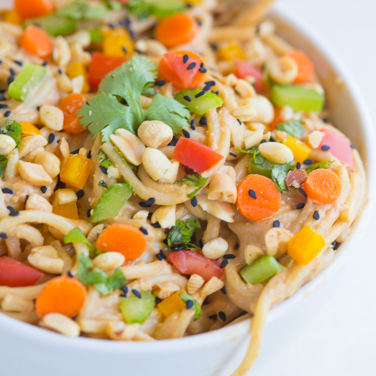 Spicy Thai noodles are a quick and easy dinner recipe that can be ready in under 20 minutes! The smooth, velvety peanut sauce mixed with the crunch of the fresh veggies will make you want to add this to your weekly meal plan.