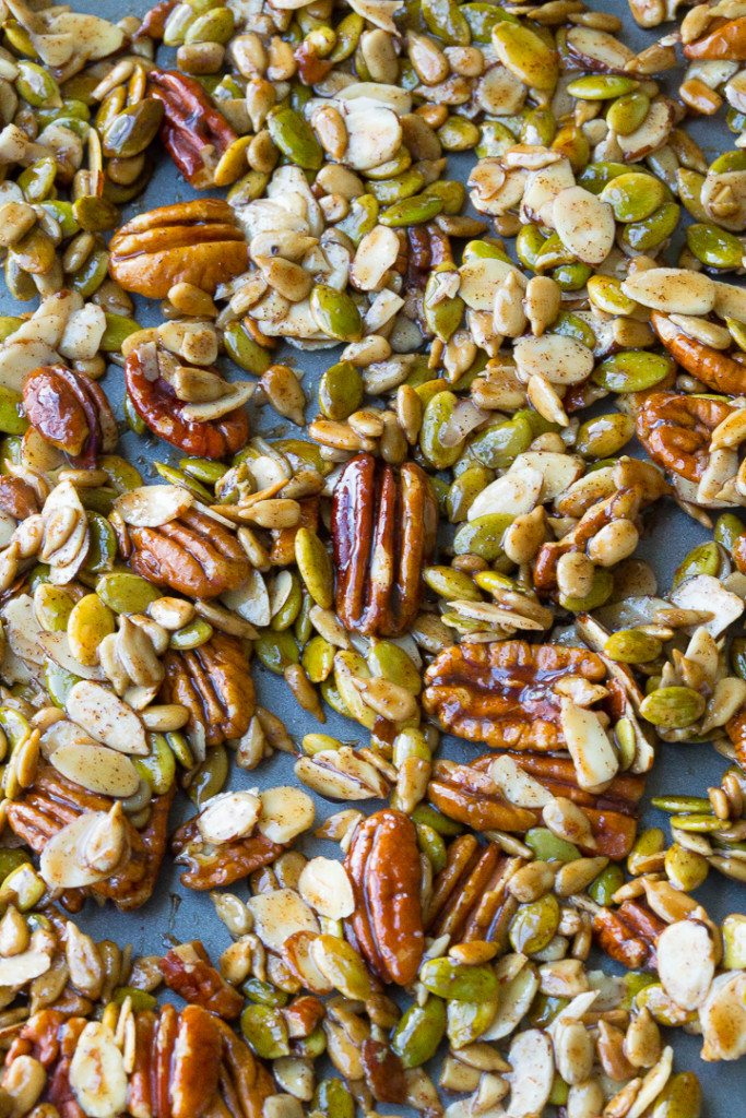 Close up of healthy homemade trail mix made with pumpkin spice almond slices, peans, and pumpkin seeds