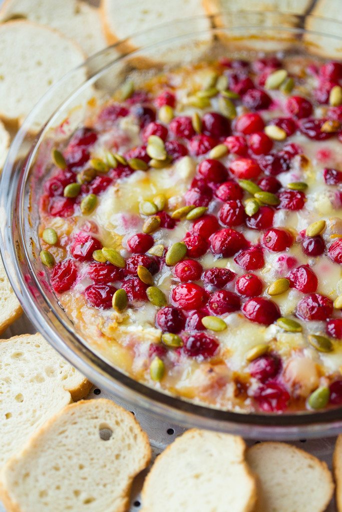 brie dip with cranberries, orange, and pumpkin seeds