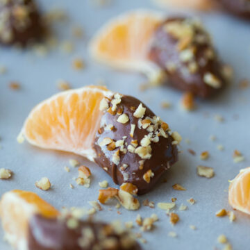 A new twist on the classic flavors of chocolate and orange, these Spiced Chocolate Covered Clementines are a perfect holiday dessert and are dripping with a rich dark chocolate that's been gently kissed by cinnamon and allspice.