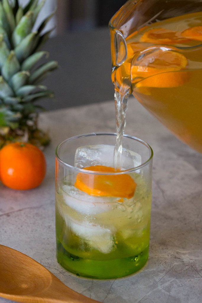 Home brewed Pineapple Orange Green Tea is crisp and cool with a hint of citrus and pineapple to get you ready for spring! Serve as is for a family friendly St. Patrick's Day, Mother's Day, or Easter drink or sassify it w/ a shot of rum or Irish whiskey. 
