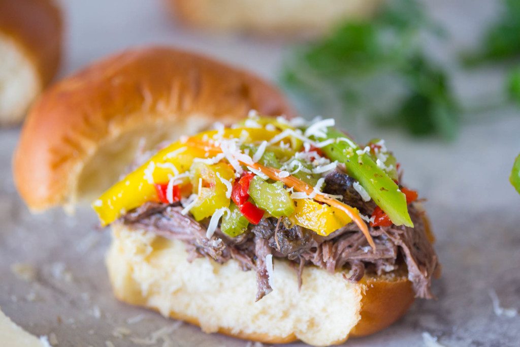 close up of open faced crock pot italian beef slider sandwich with homemade fiardiniera