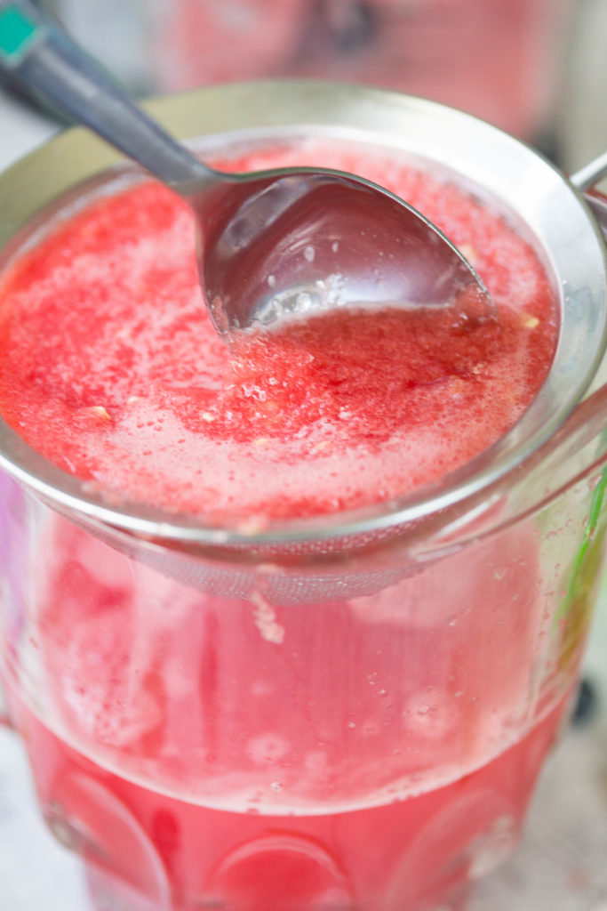 Close up of spoon in watermelon juice