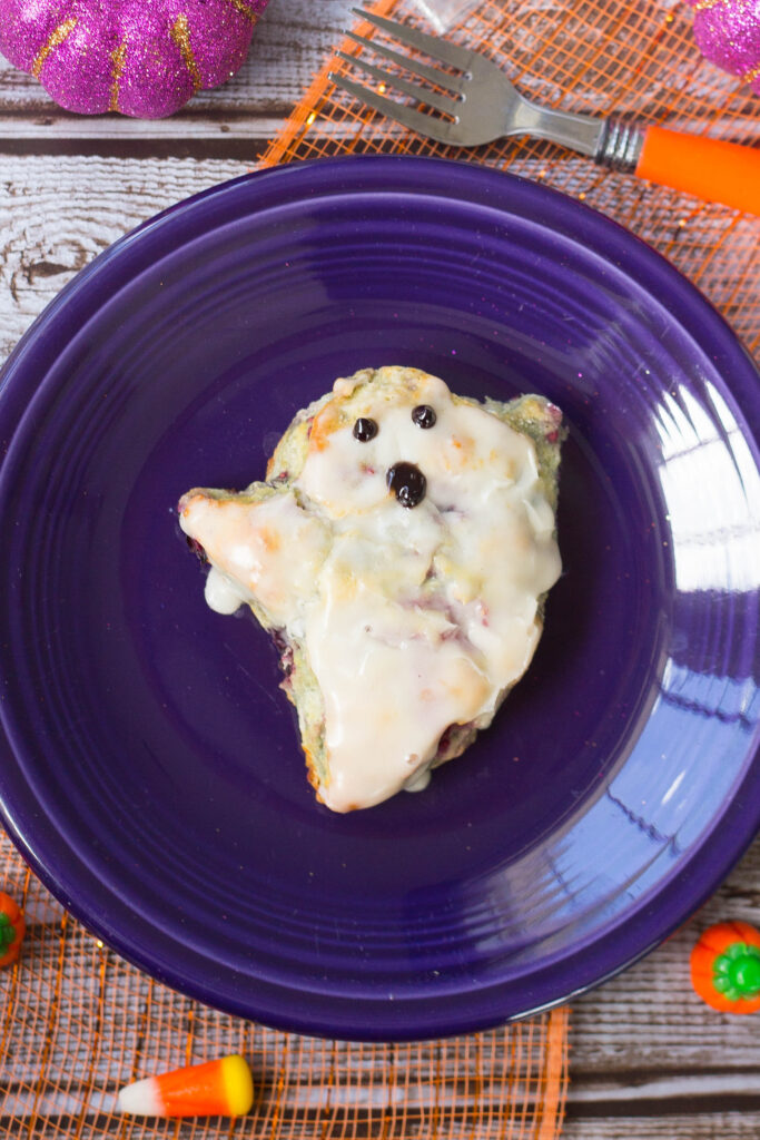 Close up shot of blueberry biscuit shaped and decorated like a ghost