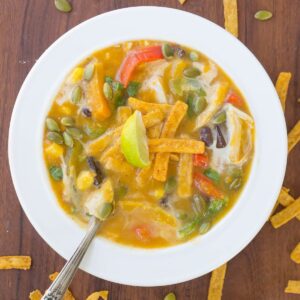 Southwest Butternut Squash Chicken Tortilla Soup topped with colorful tortilla strips