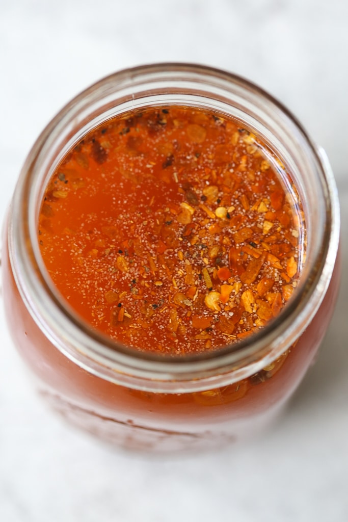 close up of Eastern Carolina bbq sauce in a mason jar