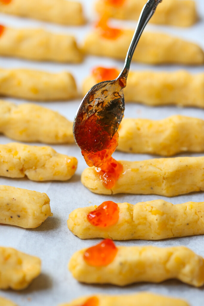 red pepper jelly dolloping on Halloween witches fingers cheese straws