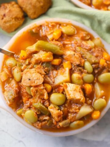 Thick Brunswick Stew in a bowl with a spoon